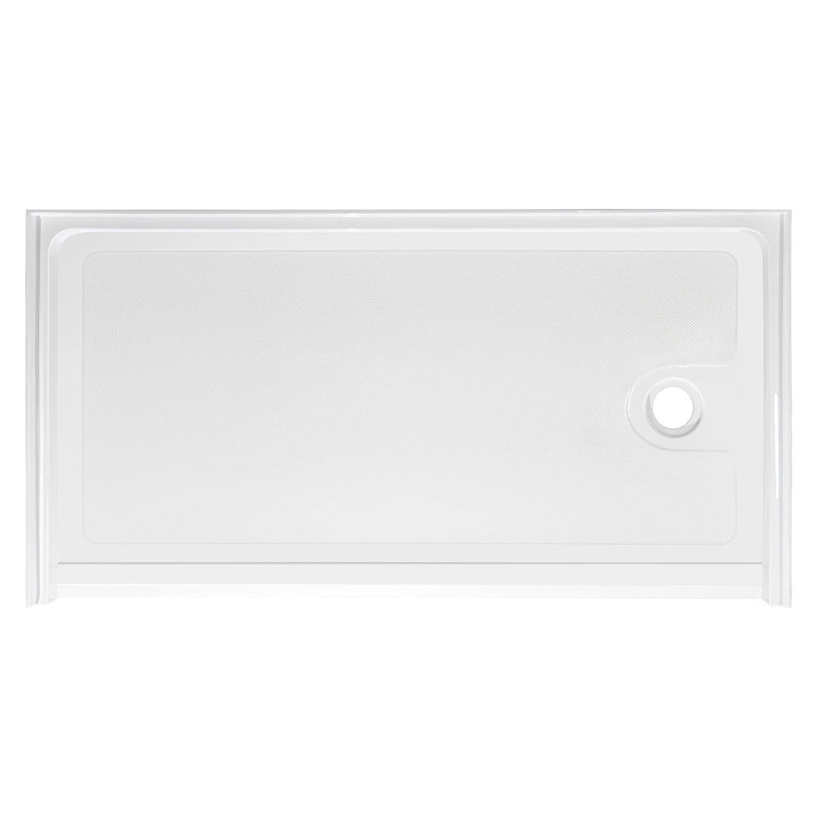 Top-down view of a rectangular, low-profile white shower base. The floor of the base has a subtle anti-slip texture pattern. There is a single circular drain hole located on the far right side. The base is surrounded by a low integrated lip or flange to contain water, viewed against a plain white background.