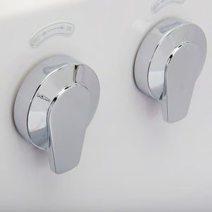 Close-up of two chrome off/on jet control valves on the wall of a white walk-in bathtub.