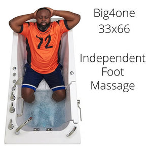 Big4one 33x66 walk-in bathtub with a man kneeling to use the independent foot massage jets, viewed from above.