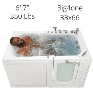 Big4one 33x66 walk-in bathtub with a 6'7", 350 lb man submerged and relaxing in active hydrotherapy jets, viewed from the side.