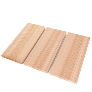 Three rectangular light-colored wood boards arranged side-by-side on a white surface, shown from an elevated diagonal perspective angle displaying their top faces and grain patterns.