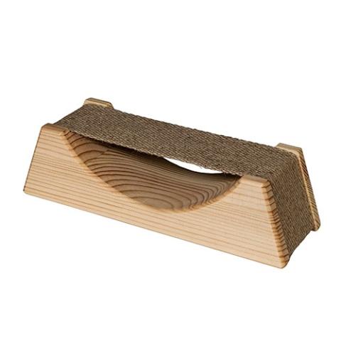 A wooden sauna headrest with a wide base that slopes up to a narrow top, set against a white background. A strip of coarse, dark brown woven fabric is stretched horizontally across the top to serve as a flexible neck cradle. The front panel is made of smooth, light-colored natural wood with prominent, wavy concentric grain lines. A deep U-shaped dip is smoothly carved into the top edge of this front panel, creating an open space beneath the suspended fabric support.