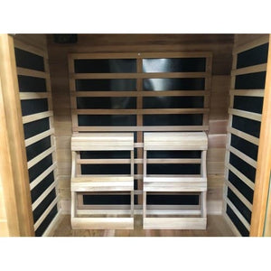 An interior perspective of the SunRay Sierra 2-Person Indoor Infrared Cedar Sauna (model HL200K_5), showing individual slanted wooden backrests positioned in front of the rear heating panel, flanked by side heating panels and cedar wood walls.