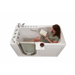 Ella Ultimate 30"x60" Acrylic Air and Hydro Massage + Independent Foot Massage Walk-In-Bathtub, Swing Door, 5 Fast Fill Faucet, 2" Dual Drain - Cast acrylic high gloss finish, fiberglass gel-coat reinforced with Brushed stainless steel and frosted tempered glass door with an extended lever lock, Left side inward swing door, Rugged stainless steel frame with 360° swivel tray Walk-In-Bathtub with 1 woman relaxing while reading inside the bathtub in a white background