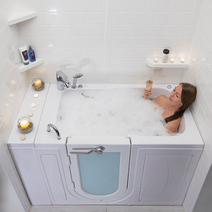 A woman relaxing in a Ella Capri 30"x52" Soaking + Heat Walk-In Bathtub with Right Swing Door, 5 Piece Fast Fill Faucet, 2" Dual Drain, 2 overflows, two 5 ft. incoming supply lines and 2 drain elbows, 2 stainless steel grab bars