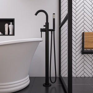 ALFI AB2534 Single Lever Floor Mounted Tub Filler Mixer with Hand Held Shower Head Solid brass construction coated with a Matte Black finish in the bathroom beside the bathtub