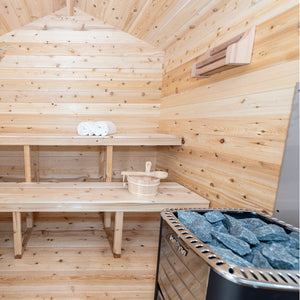 Dundalk Canadian Timber Georgian Cabin Sauna CTC88W - Eastern White Cedar - with Solid Cedar Wood Benches, bucket & ladle, harvia heater, cedar bottle shelf, two white towels - Inside view