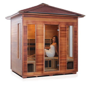 Rustic infrared sauna Canadian red cedar with peak roof and glass door and window side rear view with young woman model inside isometric view