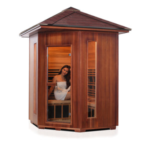 Rustic Infrared Sauna Canadian red cedar inside and out  with peaked roof and glass door and windows with young woman model