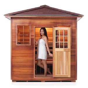 Enlighten Sauna InfraNature Original Infrared Outdoor Canadian red cedar inside and out 5 person sauna with peak roof and woman model front view