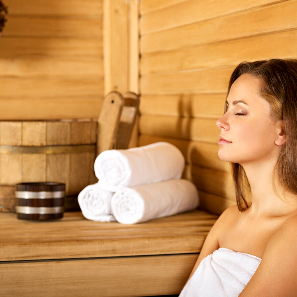 Affordable Home Saunas - Woman resting in indoor sauna