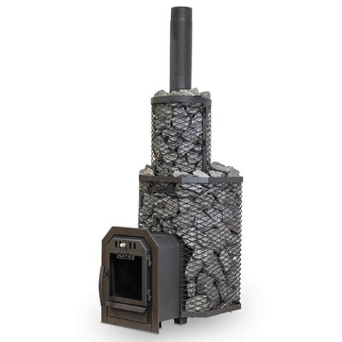 A multi-tiered Cozy Heat Thru-Wall wood-burning sauna stove is shown against a white background. The lower tier features an octagonal black wire mesh cage filled with grey stones, which extends forward into a tunnel for through-wall installation with an open door frame. Stacked on top is a smaller cylindrical mesh cage, also packed with grey stones, with a matte black exhaust pipe extending vertically from the center.