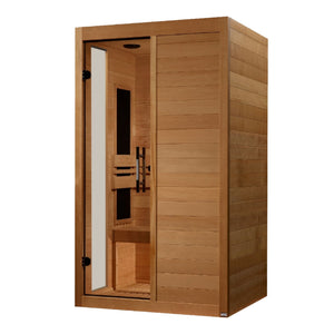 A three-quarter view of a rectangular wooden sauna cabin with horizontal light brown planks. The right side is a solid wood wall, while the left half features a full-length glass door with a long, vertical silver handle. Inside, the light wood interior reveals a slatted wooden bench, a slatted floor grid, a supportive backrest, and a vertical black infrared heating panel mounted on the side wall. The clear glass door is mounted with two black hinges on the far left.