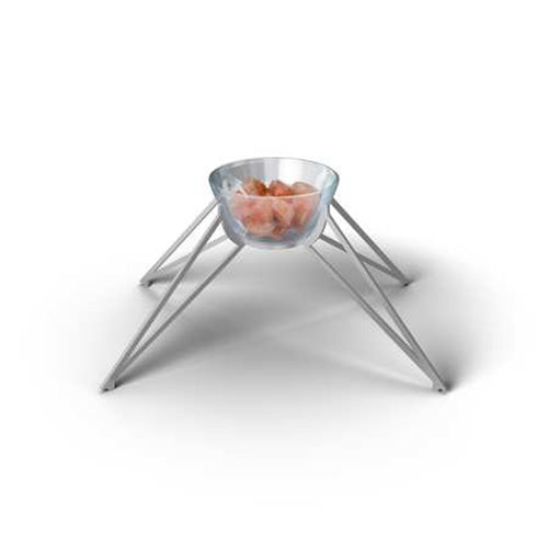 Glass bowl with pink Himalayan salt chunks on a metal tripod stand.