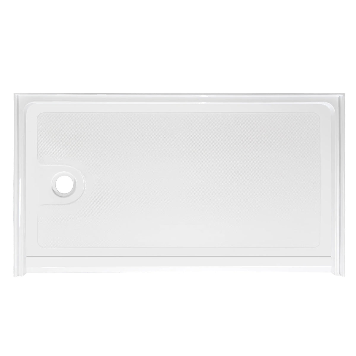 Top-down view of a rectangular, low-profile white shower base. The floor of the base has a subtle anti-slip texture pattern. There is a single circular drain hole located on the far left side. The base is surrounded by a low integrated lip or flange to contain water, viewed against a plain white background.
