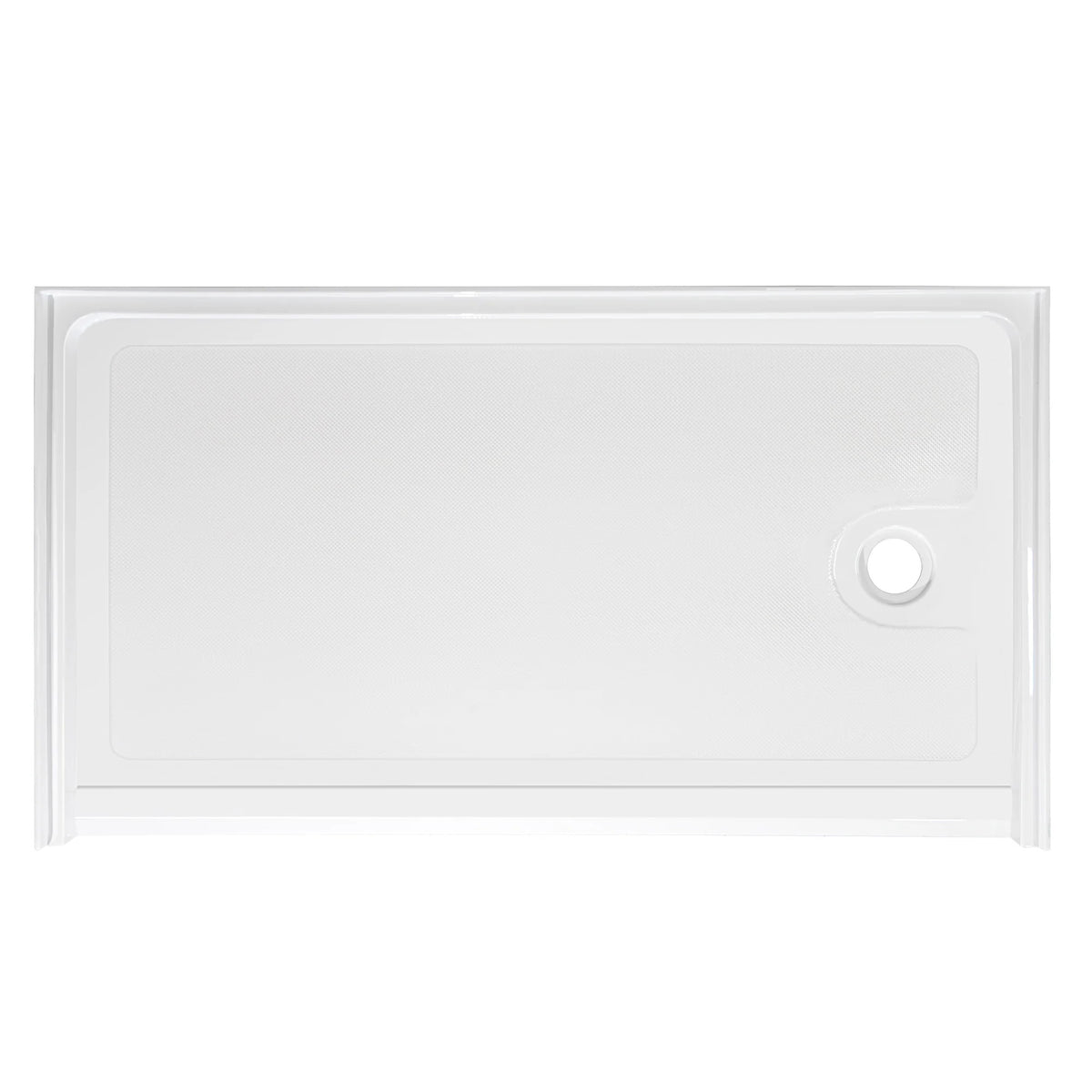 Top-down view of a rectangular, low-profile white shower base. The floor of the base has a subtle anti-slip texture pattern. There is a single circular drain hole located on the far right side. The base is surrounded by a low integrated lip or flange to contain water, viewed against a plain white background.