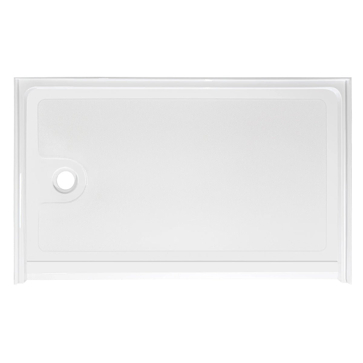 Top-down view of a rectangular, low-profile white shower base. The floor of the base has a subtle anti-slip texture pattern. There is a single circular drain hole located on the far left side. The base is surrounded by a low integrated lip or flange to contain water, viewed against a plain white background.
