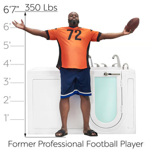 White walk-in bathtub shown beside a 6'7", 350 lb former professional football player for size comparison, with a height scale from 1' to 6'7" on the left.