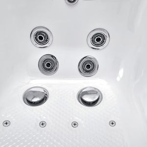 Close-up of chrome hydrotherapy jets and textured seat floor inside a white walk-in bathtub.