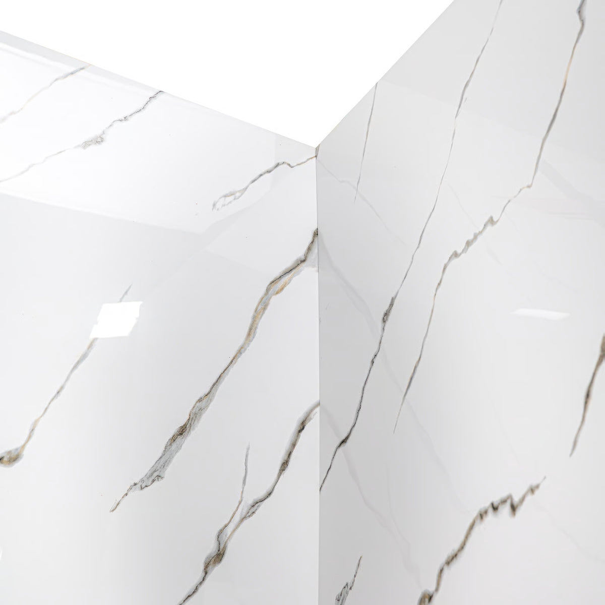 Close-up view of a white-and-gold marble-pattern bathtub wall surround corner panel, isolated on a white background.