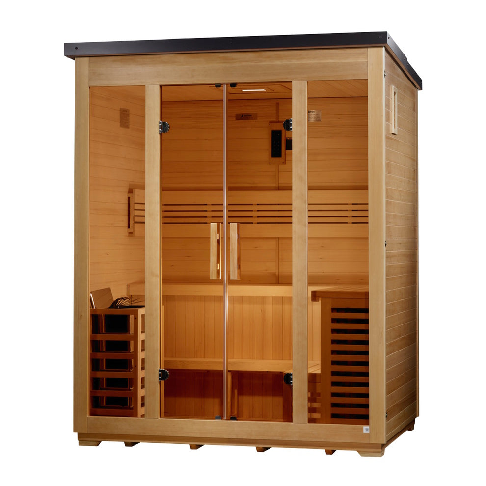 A freestanding, rectangular wooden sauna cabin with light-tan planks and a flat, dark gray roof, shown from a slight right angle. The wide front features four glass panels: two fixed outer windows and two central glass doors with vertical wooden handles. The interior shows an L-shaped, two-tier bench wrapped along the back and right walls, paired with slatted backrests. A wooden-slat heater cage is on the bottom left, and a tall, dark-vented wooden console stands on the bottom right.