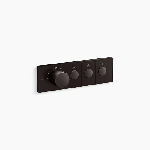 A horizontal, rectangular Kohler K-26347-9 Anthem mechanical thermostatic valve control in brushed graphite, angled slightly right against a white background. The sleek faceplate features four cylindrical knobs in a row. The first knob on the left is much larger and thicker, surrounded by small indicator dots for temperature. To its right are three smaller, identical control knobs, each centered within a rectangular segment containing a small icon above it.