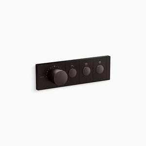 A horizontal, rectangular Kohler K-26347-9 Anthem mechanical thermostatic valve control in brushed graphite, angled slightly right against a white background. The sleek faceplate features four cylindrical knobs in a row. The first knob on the left is much larger and thicker, surrounded by small indicator dots for temperature. To its right are three smaller, identical control knobs, each centered within a rectangular segment containing a small icon above it.