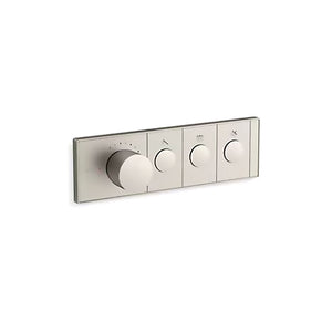 A horizontal, rectangular Kohler K-26347-9 Anthem mechanical thermostatic valve control in brushed nickel, angled slightly right against a white background. The sleek faceplate features four cylindrical knobs in a row. The first knob on the left is much larger and thicker, surrounded by small indicator dots for temperature. To its right are three smaller, identical control knobs, each centered within a rectangular segment containing a small icon above it.