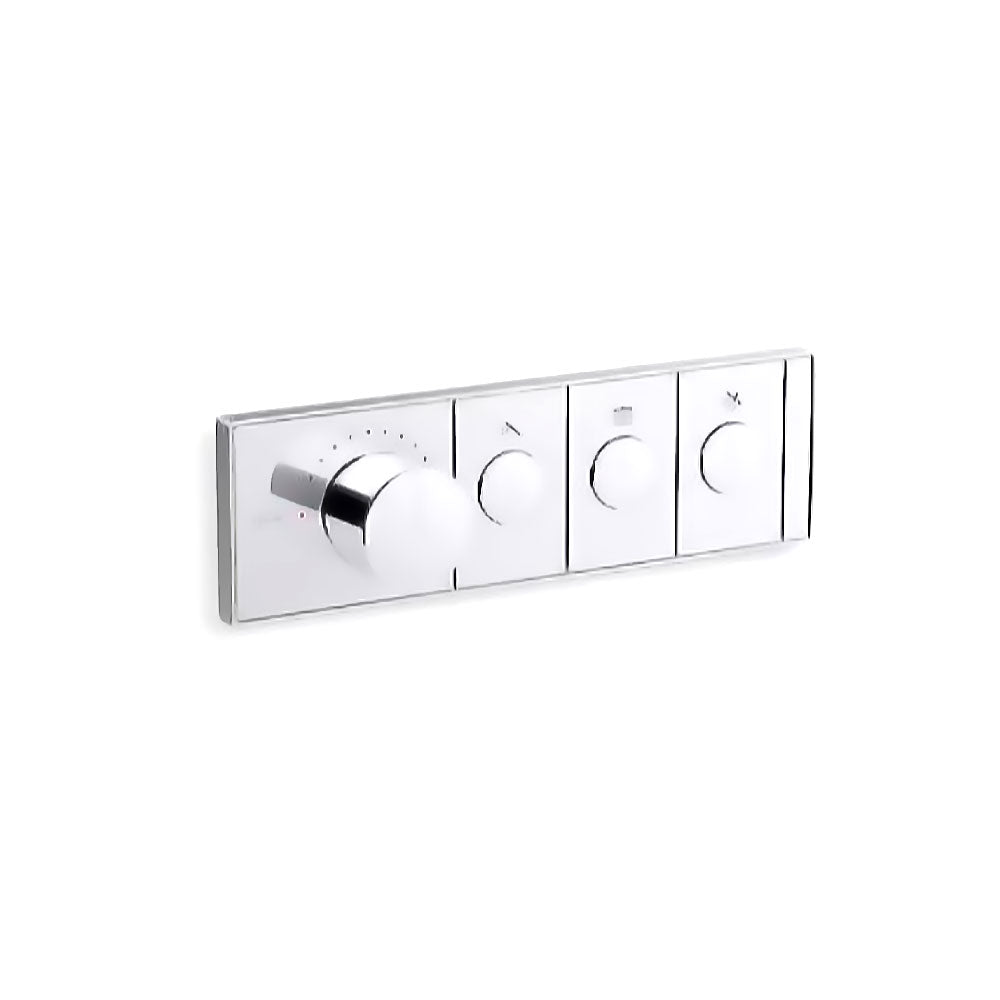 A horizontal, rectangular Kohler K-26347-9 Anthem mechanical thermostatic valve control in polished chrome, angled slightly right against a white background. The sleek faceplate features four cylindrical knobs in a row. The first knob on the left is much larger and thicker, surrounded by small indicator dots for temperature. To its right are three smaller, identical control knobs, each centered within a rectangular segment containing a small icon above it.