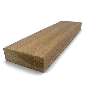 A rectangular wood plank viewed from a three-quarter perspective, displaying the smooth top face, long edge, and textured cross-section end grain on the left.