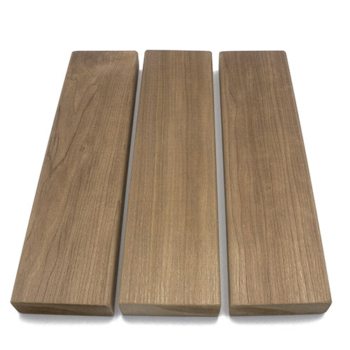 Three rectangular wood planks arranged side by side from a high-angle perspective, showcasing natural swirled and linear grain variations with a consistent medium brown color.