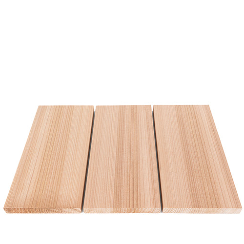 Three rectangular light-colored wood boards arranged side-by-side on a white surface, shown from a front perspective angle highlighting their dense, straight vertical grain patterns.