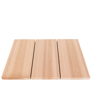 Three rectangular light-colored wood boards arranged side-by-side on a white surface, shown from a front perspective angle highlighting their dense, straight vertical grain patterns.