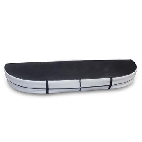 An elongated, oval-shaped grey hot tub cover resting on a white surface. It is upholstered in a smooth, matte vinyl material and is divided down the center by a straight, raised seam that allows the two symmetrical halves to fold. A matching grey fabric skirt hangs down along the entire outer edge, and a small, rectangular fabric handle is attached horizontally to the front-right side of the skirt.