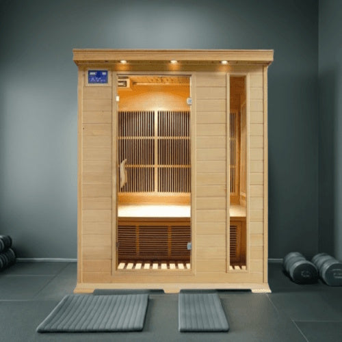 Studio product shot of the SunRay 3-Person Aspen Indoor Infrared Sauna (model HL300K2) against a plain white background, featuring a light wood construction, a glass door next to a vertical glass window panel, a blue digital control panel, and recessed ceiling lights.