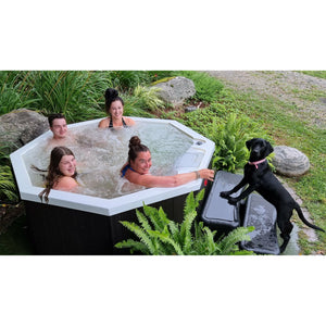 Canadian Spa Muskoka 5-Person 14-Jet Portable Plug & Play Hot Tub - White inside - Black outside - adjustable stainless steel hydrotherapy jets - Filled with water - Size: 74" x 74"x 29" - Outdoor setup - with 4 person model - KH-10096 - Vital Hydrotherapy