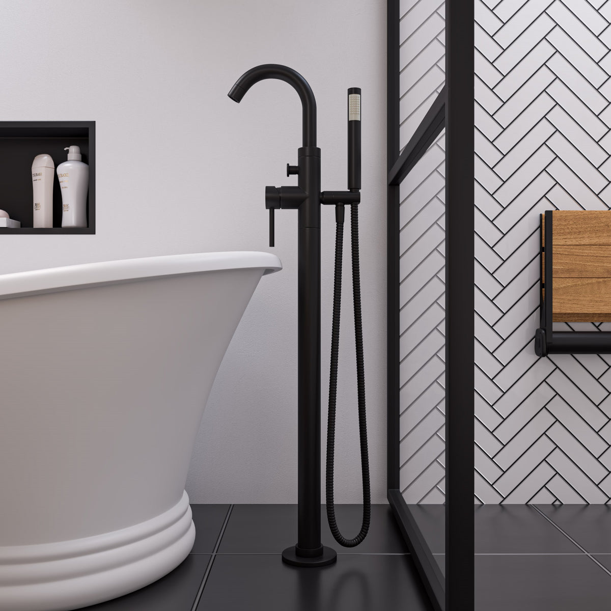 ALFI AB2534 Single Lever Floor Mounted Tub Filler Mixer with Hand Held Shower Head Solid brass construction coated with a Matte Black finish in the bathroom beside the bathtub