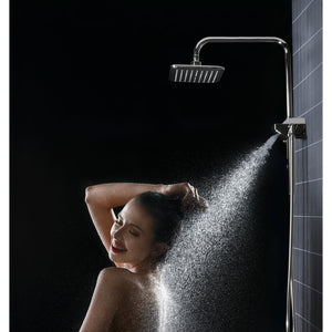 PULSE ShowerSpas Shower System - AquaPower ShowerSpa - Oversized showerhead with soft tips, 3-function wand hand shower and hand shower holder and diverter at the bottom of Aqua Power - Polished Chrome - Lifestyle setting with woman model 1054 - Vital Hydrotherapy
