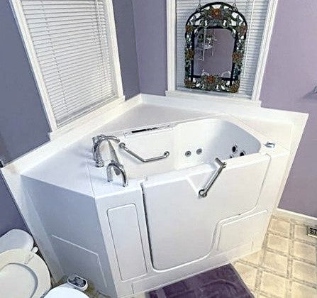Avora Bath 32" x 52" Wheelchair Transfer Walk-In Tub white with left outward swing door - air and vibration jets - 5 piece roman faucet set -  hand shower with pull out hose - lifestyle - Vital Hydrotherapy