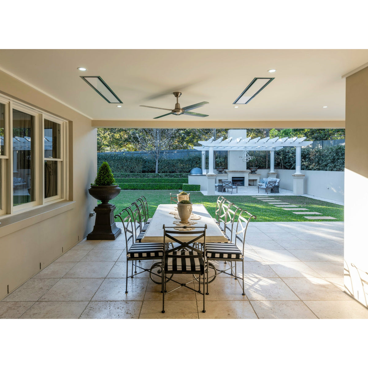 2300W Platinum Smart-Heat Electric Heater in White Stainless Steel Tinted Glass-Ceramic Screen Slim-line Design mounted in a ceiling of a terrace