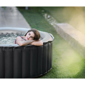 MSpa Delight Series Silver Cloud Inflatable Spa - elegant round design and clean lines with one female relaxing located outdoor