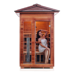 Enlighten Sauna Infrared/Traditional DIAMOND Outdoor peak Roofed two person sauna Canadian Red Cedar Wood with glass door and window with young woman model front view