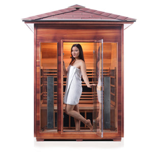Enlighten Sauna Infrared/Traditional DIAMOND Outdoor peak Roofed three person sauna Canadian Red Cedar Wood with glass door and windows inside view with young woman model front view