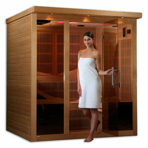 Near Zero EMF Far Infrared Sauna - Natural hemlock wood construction with FM/CD radio with MP3 auxiliary connection, Interior reading/chromotherapy lighting system, Interior and exterior LED control panel, Electrical service, Carbon PureTech™ Near Zero EMF Heat Emitters, Tempered glass door,  Roof vent in a white background with a young woman
