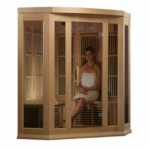 Maxxus Low EMF FAR Infrared Sauna - 3 Person - Natural hemlock wood construction with Tempered glass door and 2 full-length side windows,  Interior color therapy lighting,  Carbon heating panels, Roof vent,  Interior/exterior LED control panels,  FM Radio with BT, MP3 auxiliary, SD, and USB connection Electrical service with young woman inside in a white background
