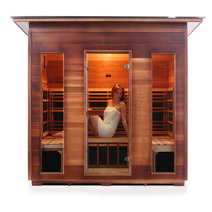 Rustic Infrared Sauna Canadian red cedar with slope roof and glass door and windows with young woman model front view