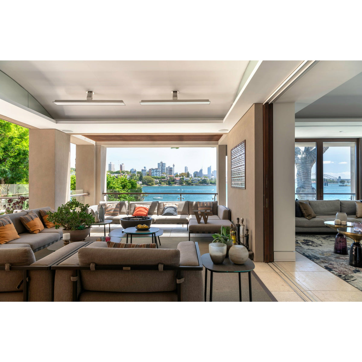 2300W Platinum Smart-Heat Electric Heater in White Stainless Steel Tinted Glass-Ceramic Screen Slim-line Design mounted in a ceiling of a dining area