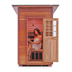 Enlighten Sauna InfraNature Original Infrared Outdoor Canadian red cedar slope Roofed two person sauna with young woman model inside view