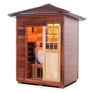 Enlighten Sauna InfraNature Original Infrared Outdoor West Canadian red cedar inside and out 3 person sauna with peak roof and woman model inside side view