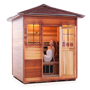 Enlighten Sauna InfraNature Original Infrared Outdoor Canadian red cedar inside and out 4 person sauna with peak roof and woman model inside open door isometric view
